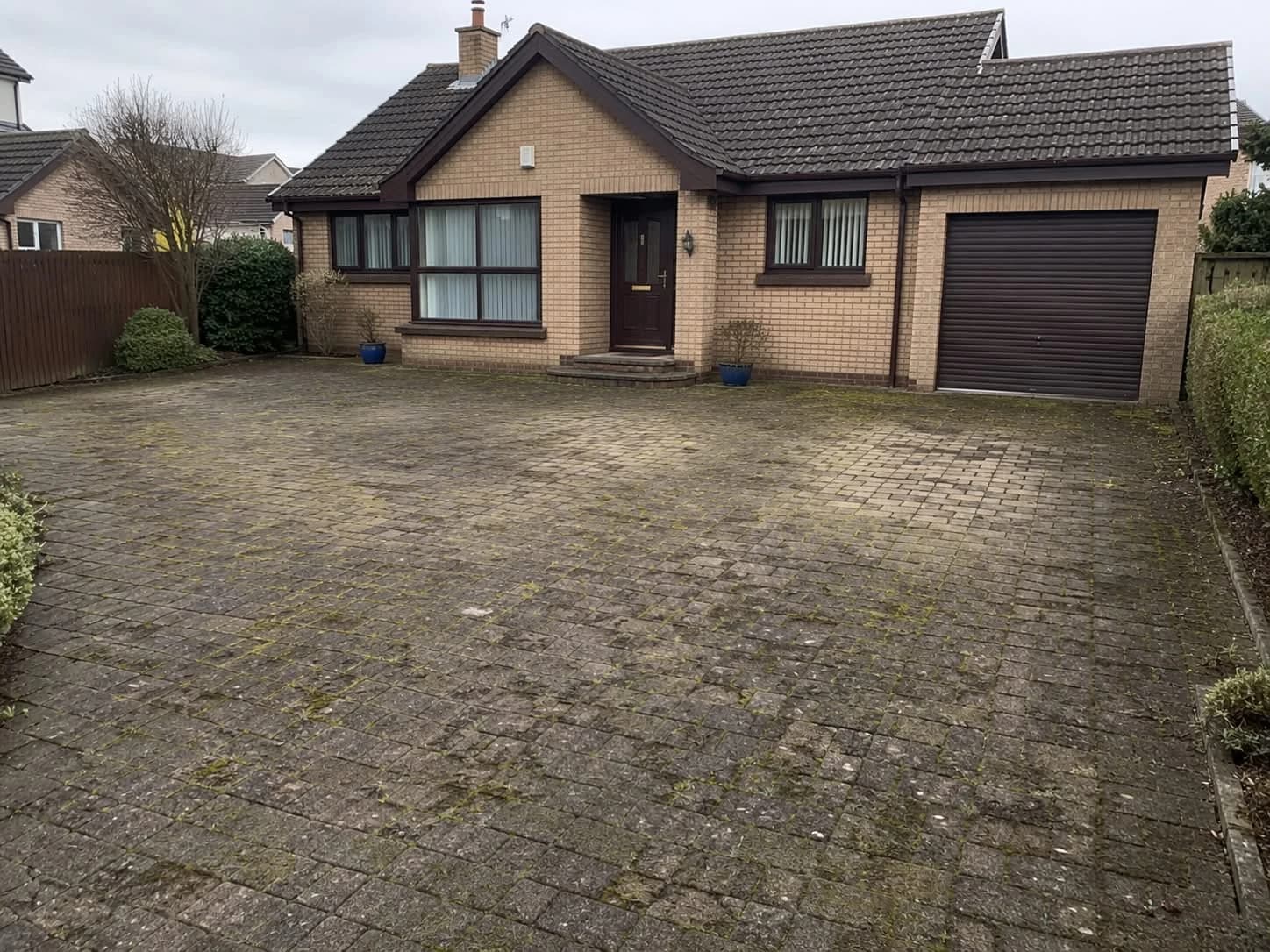Block-paved driveway in Limavady before and after professional pressure washing (before)